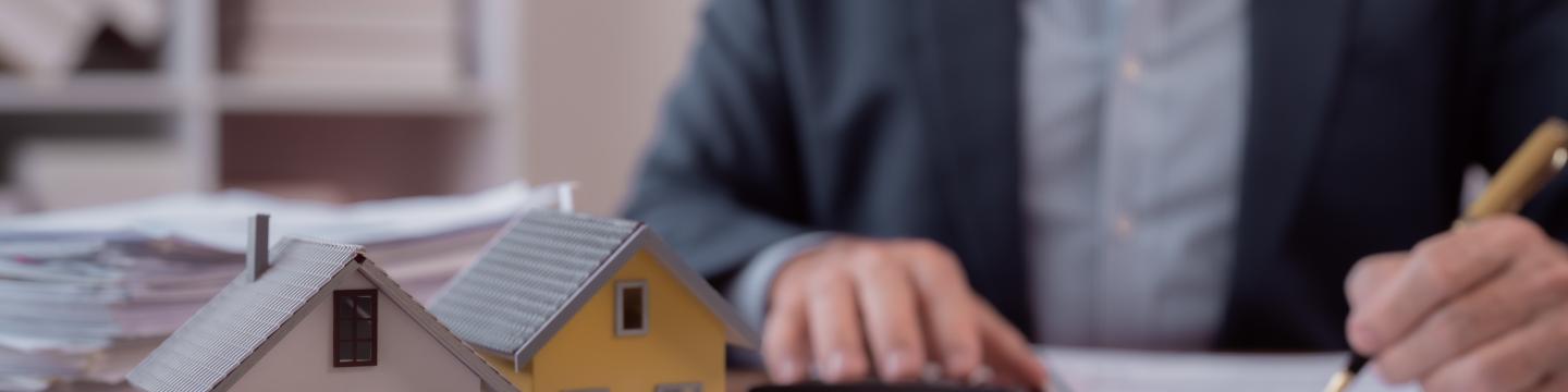 A mortgage broker working at his desk.