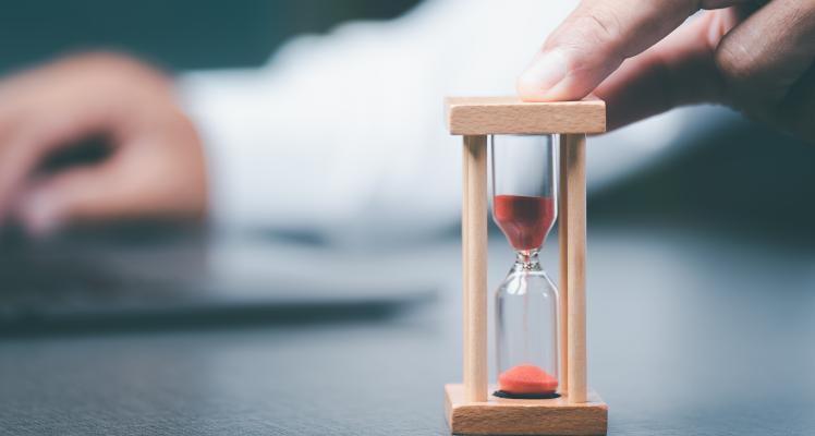 A broker with an hourglass.