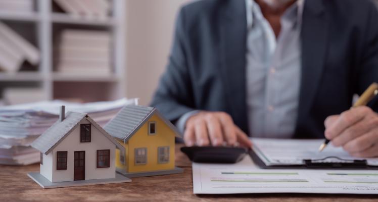 A mortgage broker working at his desk.